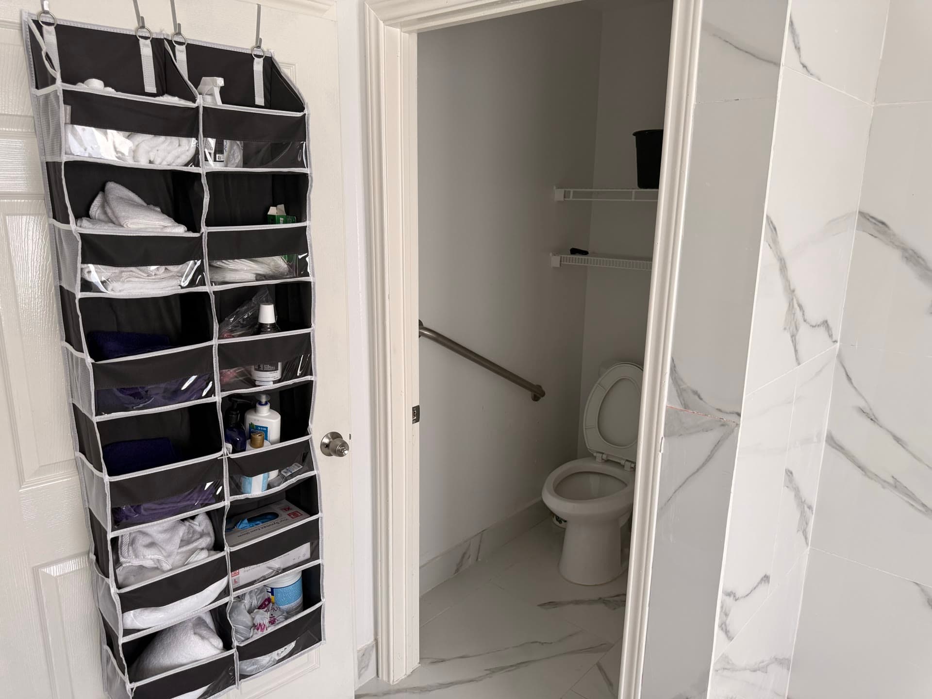 Bathroom storage area with grab bars