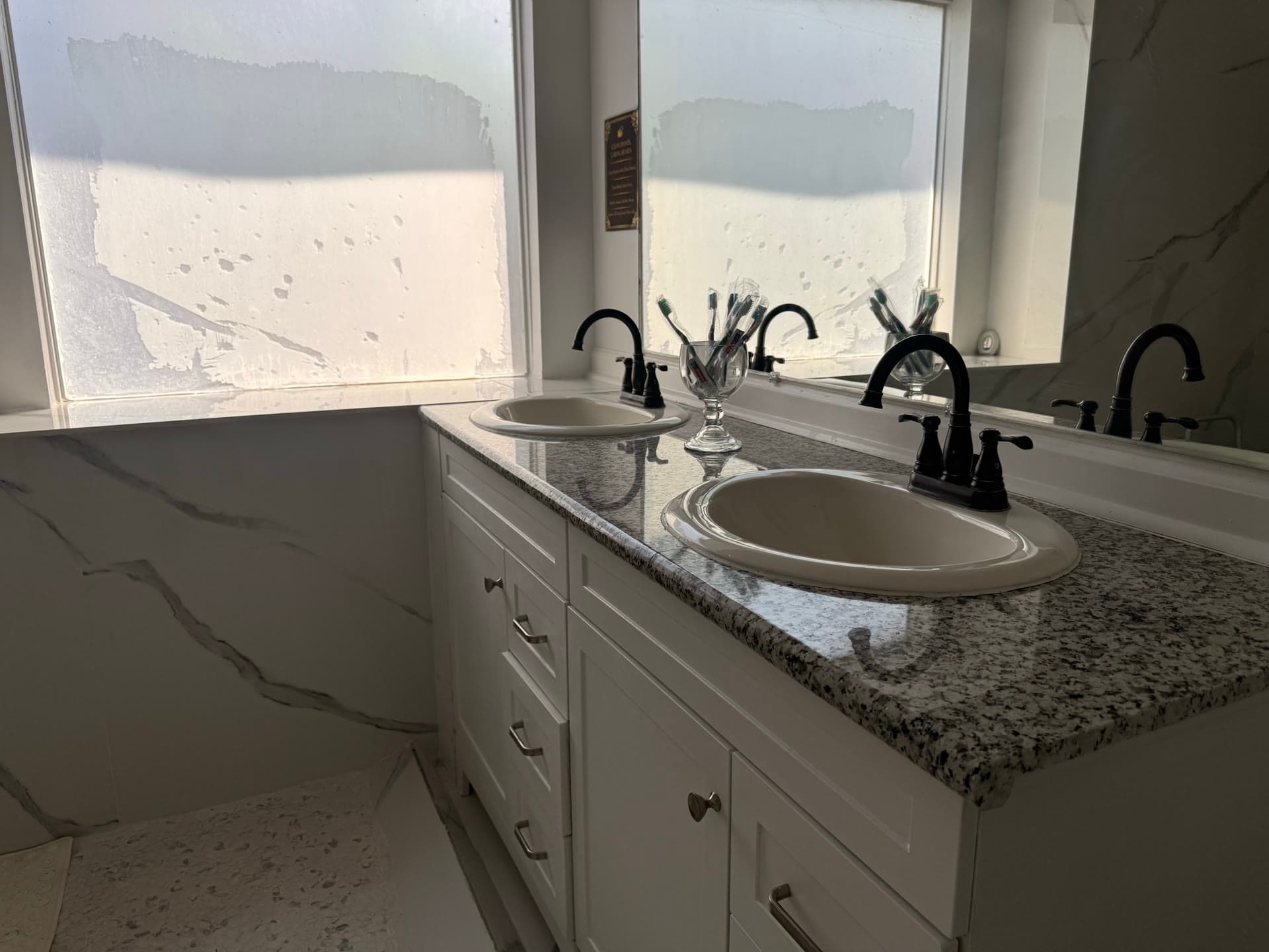 Double vanity bathroom with granite countertop