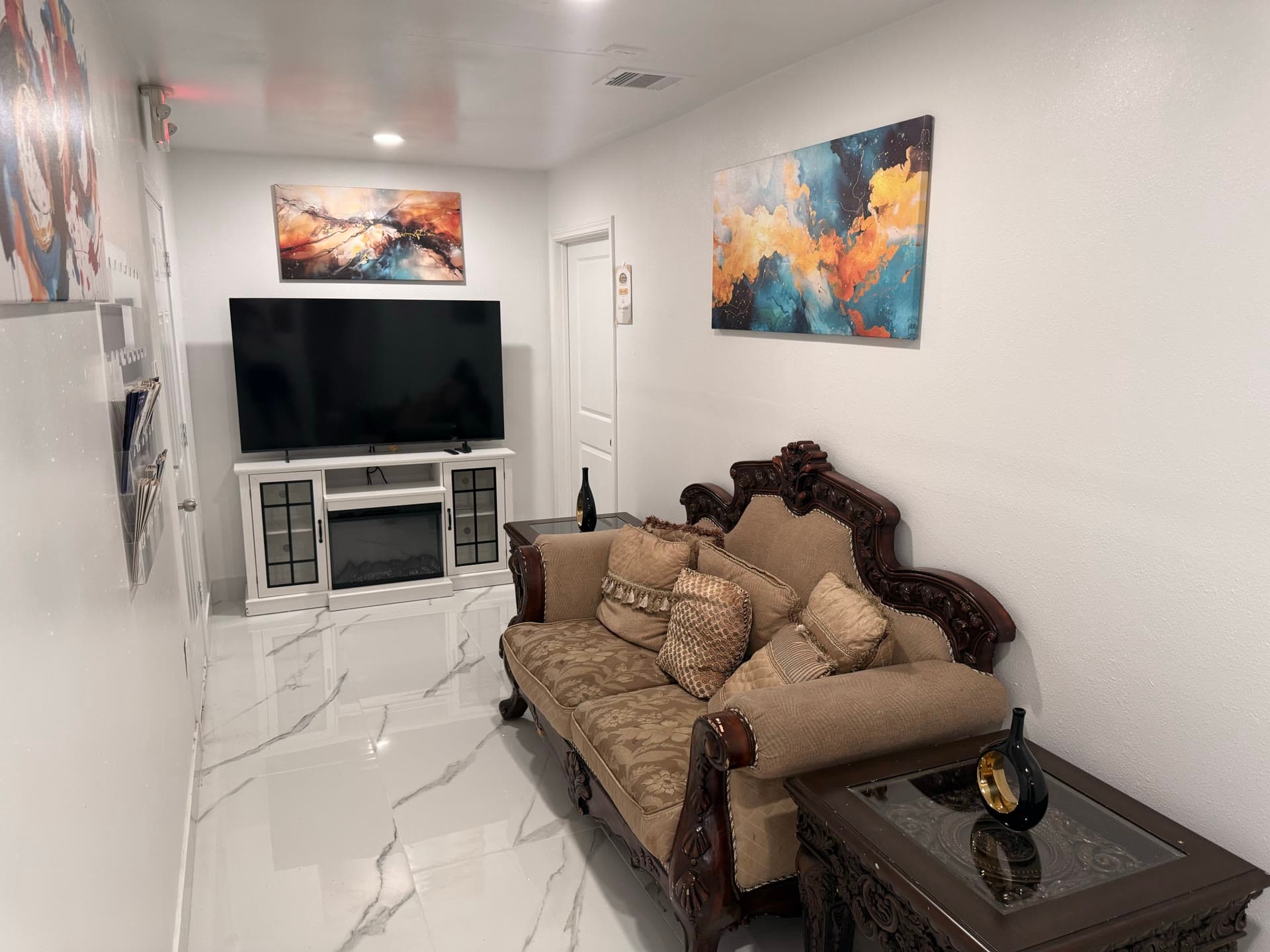 Lounge area with decorative sofa and art gallery wall