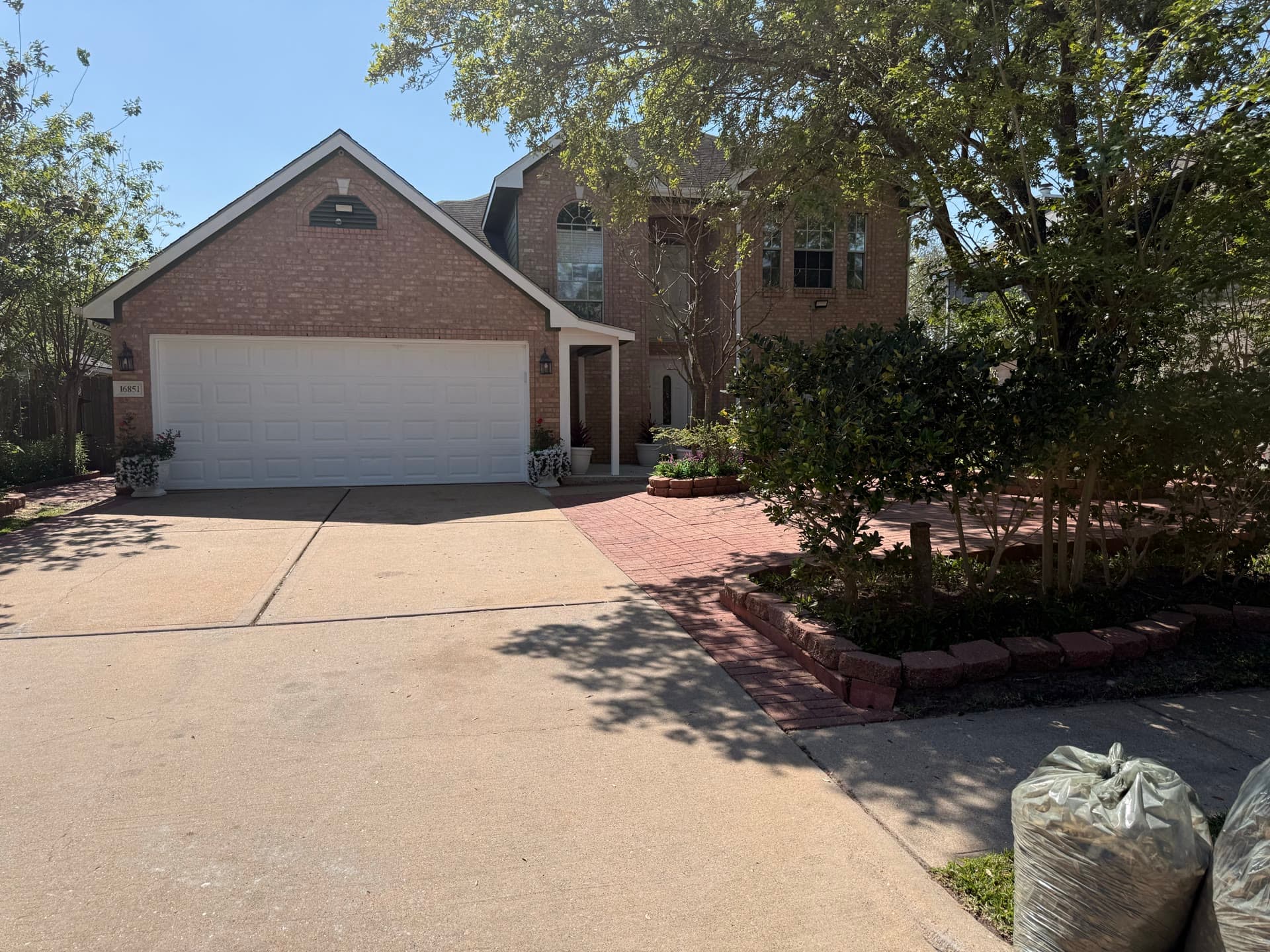 Full front view with garage and circular driveway