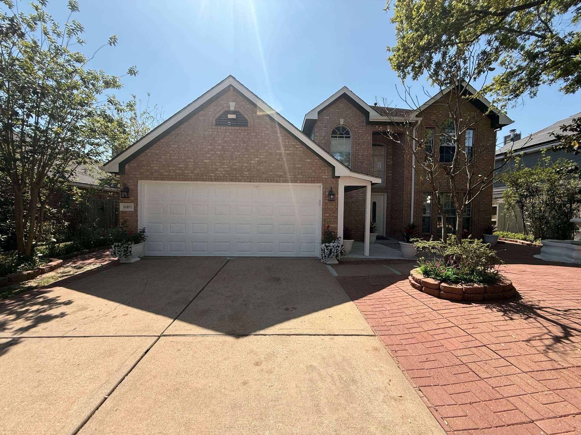 Château 529 front exterior — brick home with landscaped entrance