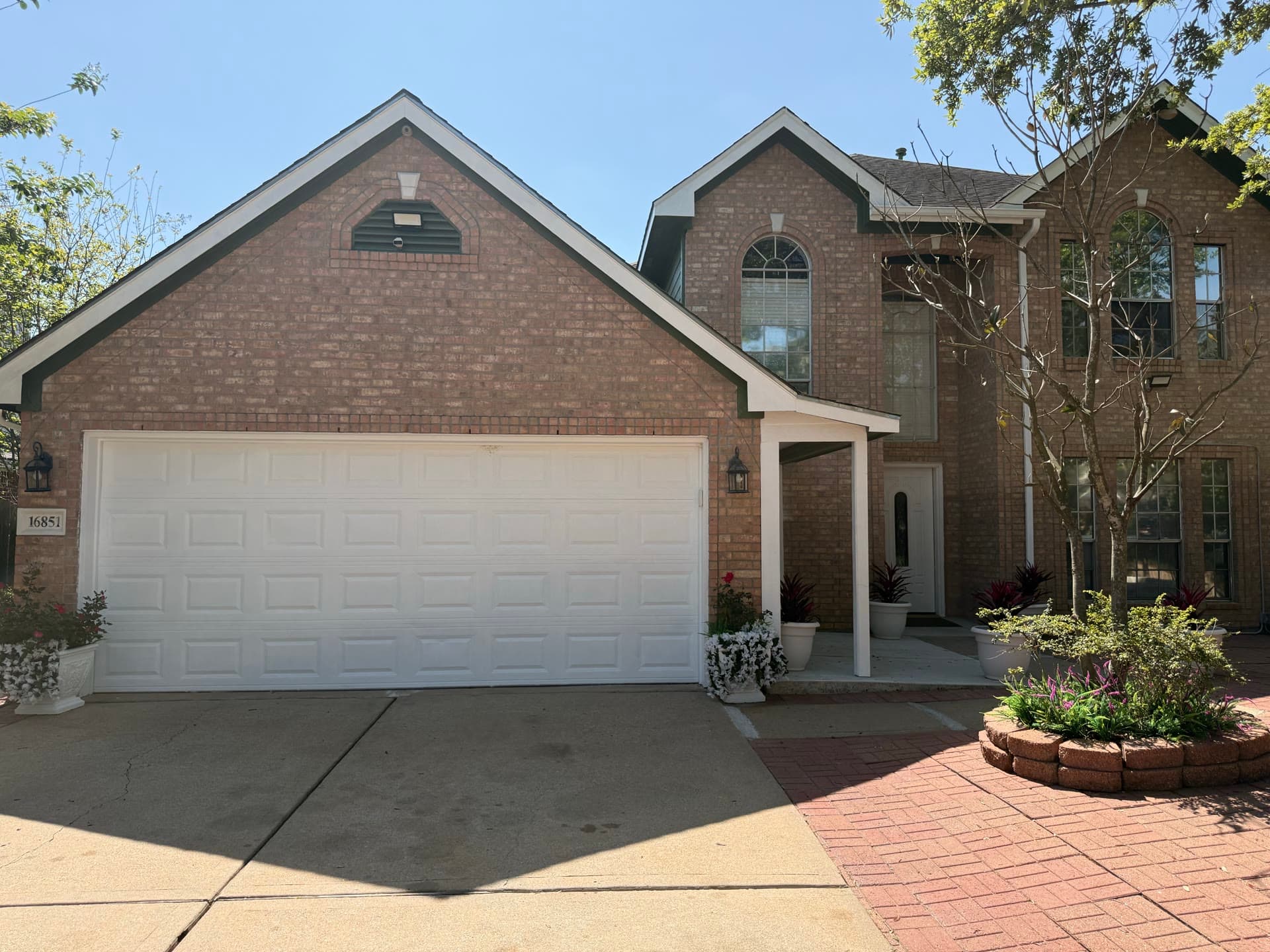 Exterior view with prominent garage entrance