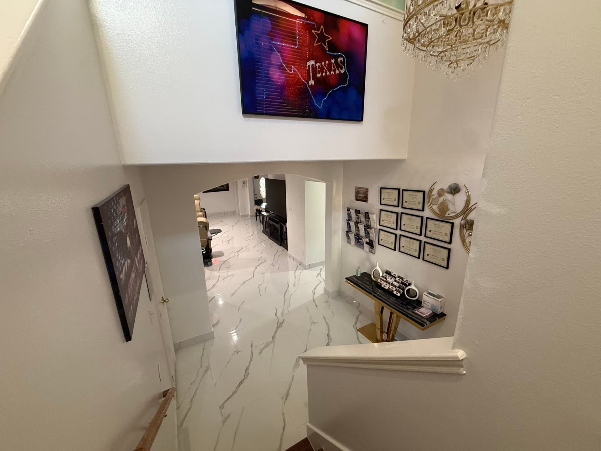 Stairway with credentials and chandelier